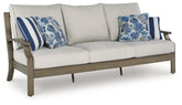 Diamond Furniture - Ashley Furniture - Rainier Ranch Outdoor Sofa with Cushion - Sofa with Cushion / Brown/Beige - P701-838