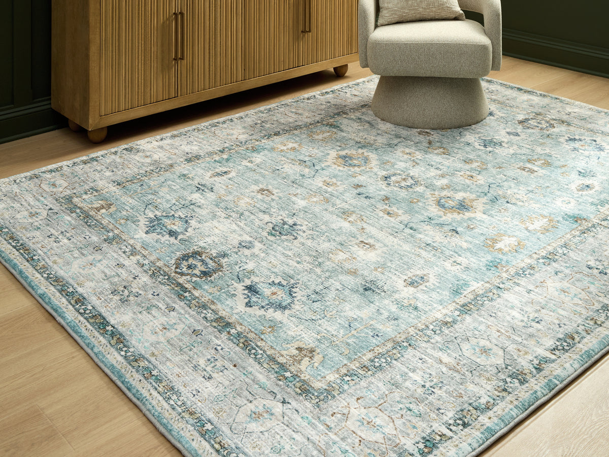 Diamond Furniture - Ashley Furniture - Ladstoney Rug - 5' x 7' Area Rug / Teal/Beige/Ochre - R407502