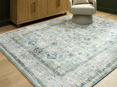 Diamond Furniture - Ashley Furniture - Ladstoney Rug - 5' x 7' Area Rug / Teal/Beige/Ochre - R407502