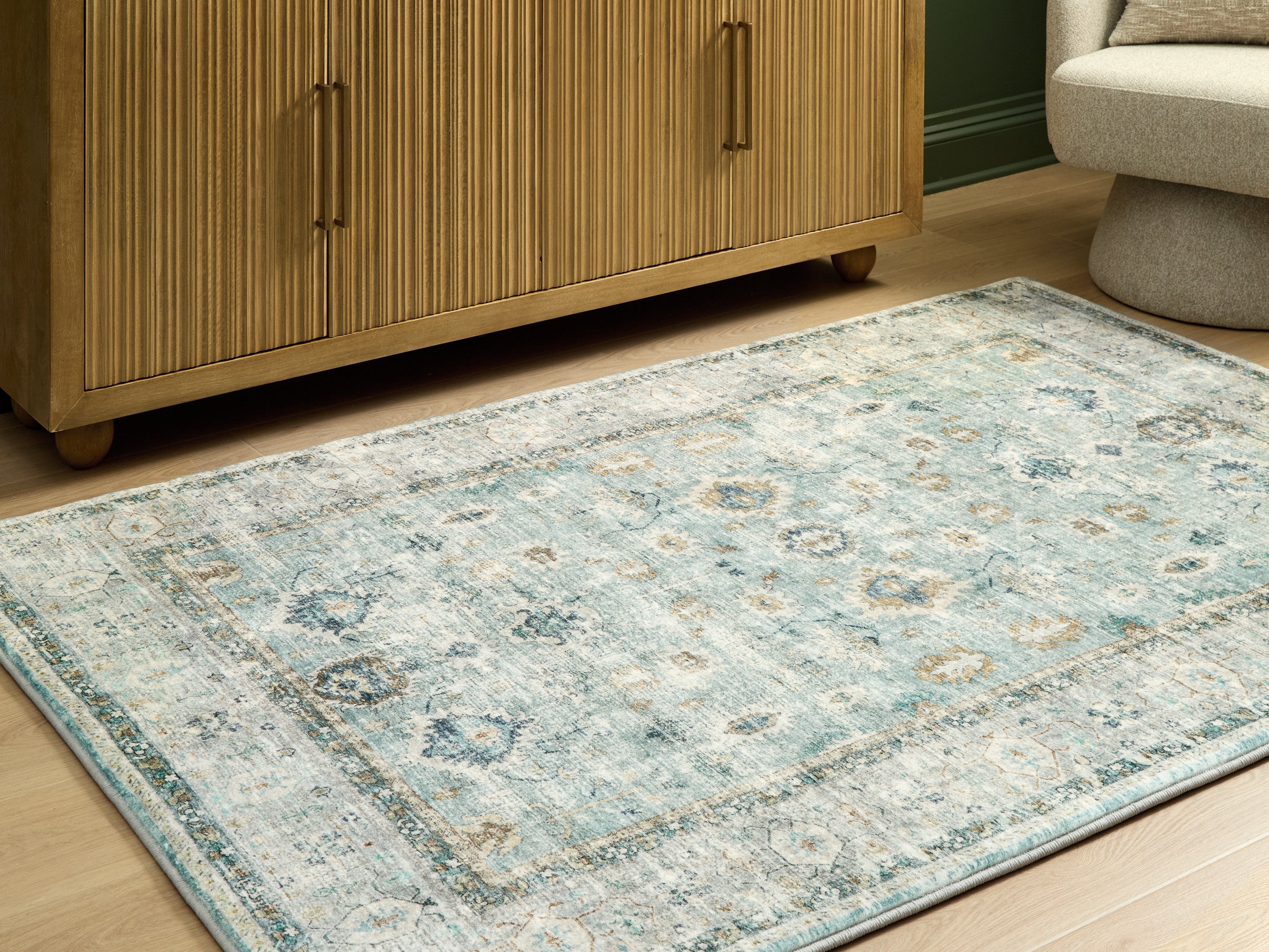 Diamond Furniture - Ashley Furniture - Ladstoney Rug - 5' x 7' Area Rug / Teal/Beige/Ochre - R407502